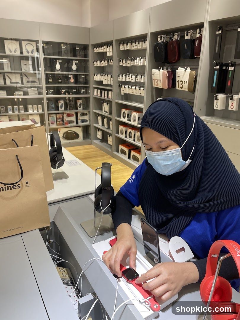 Store employee arranging a smartwatch