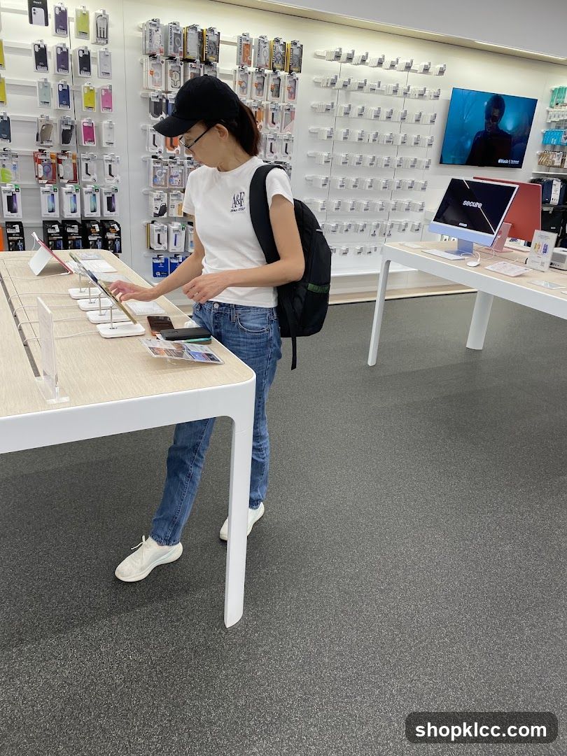 Customer browsing electronics in a store