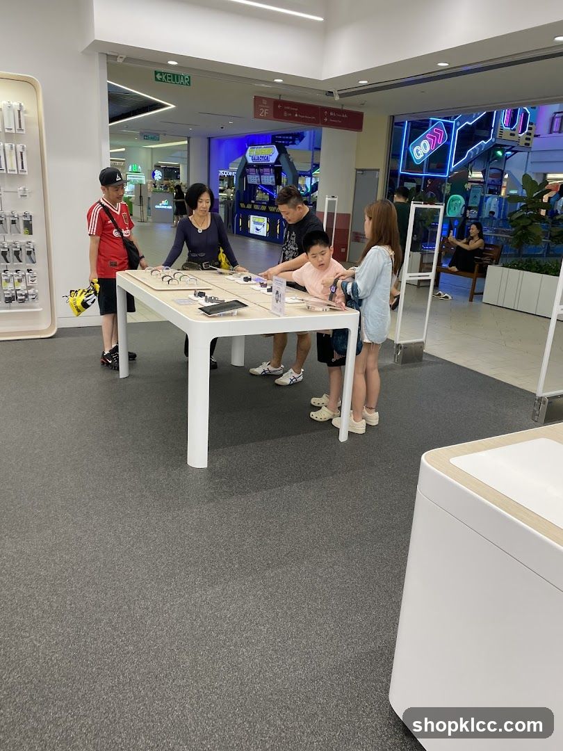 People looking at display table in store