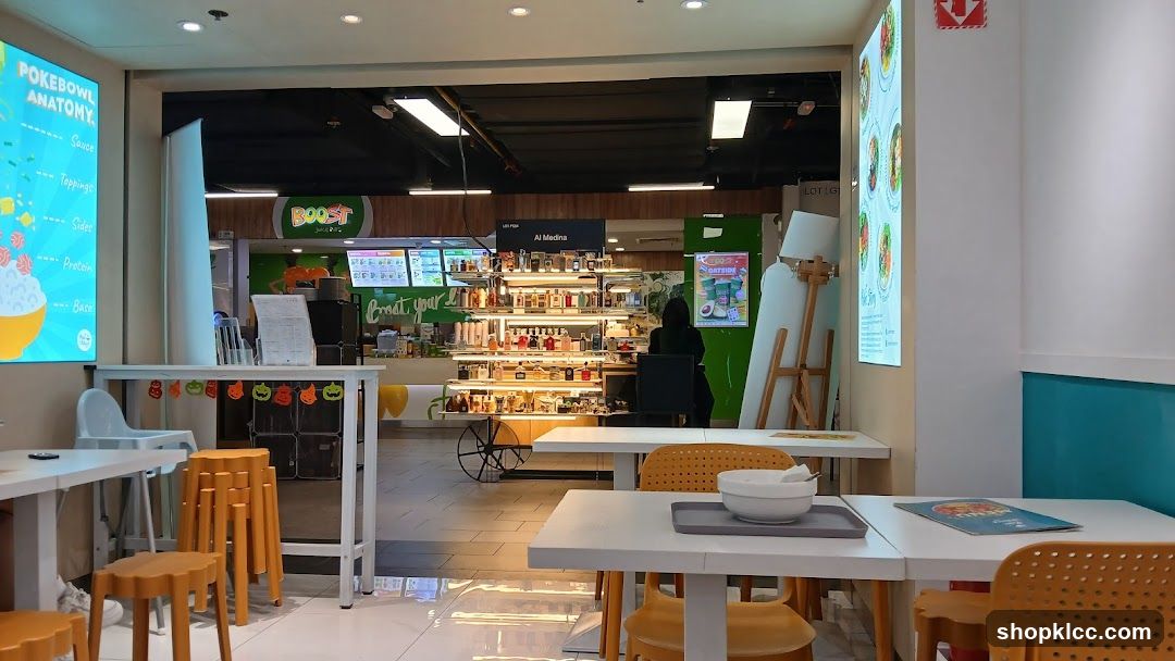 Food court interior with seating and a Boost Juice counter