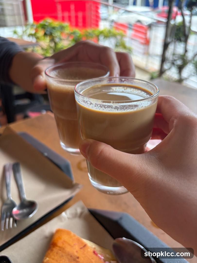Two people toasting with coffee