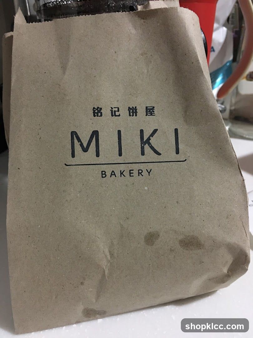 Brown paper bag with MIKI BAKERY logo