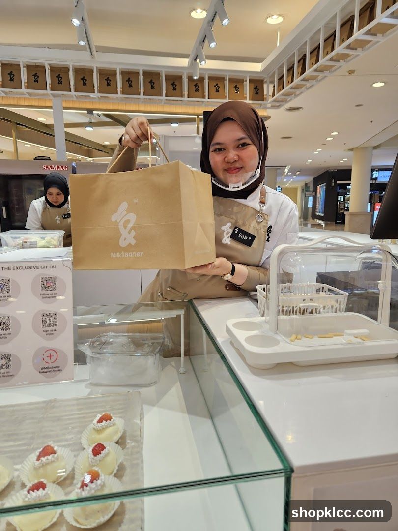 Dessert Shop Employee Holding a Bag