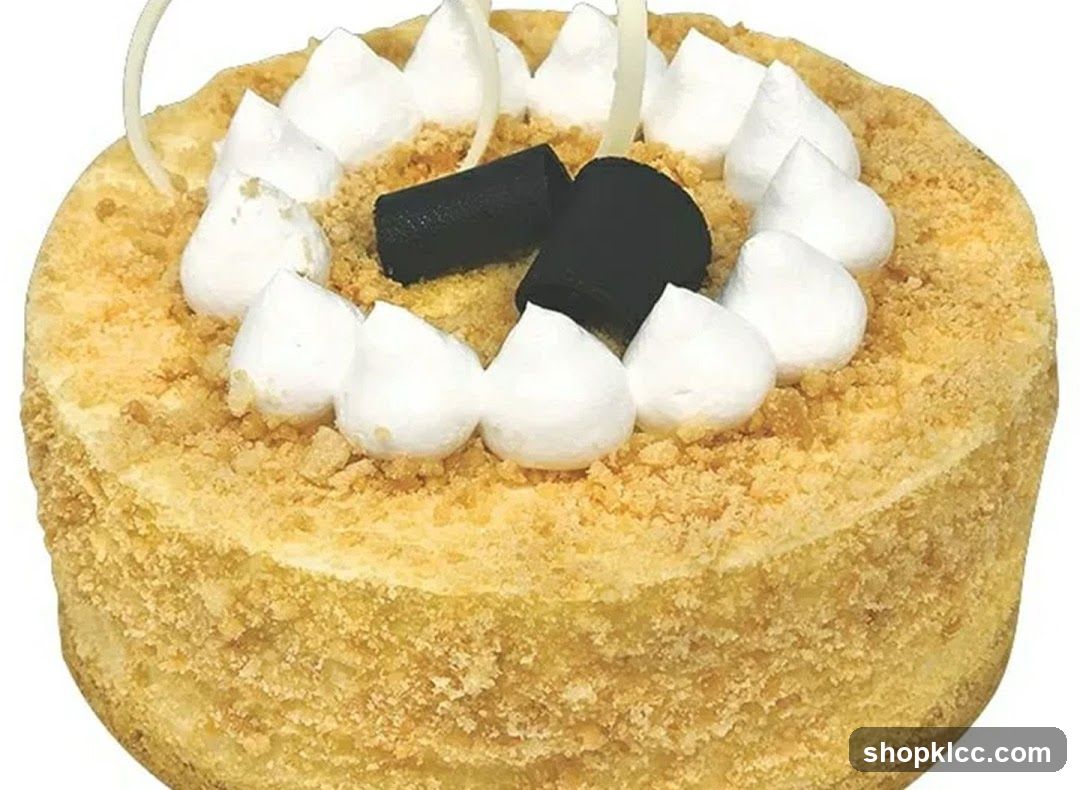 Cake with White Frosting and Chocolate Decorations