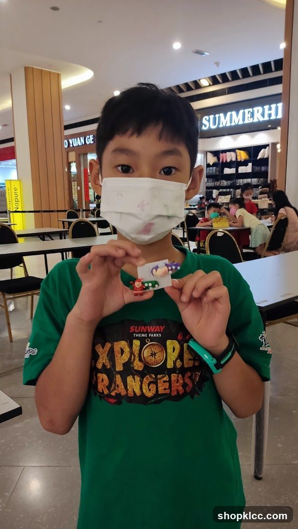 Boy holding a craft