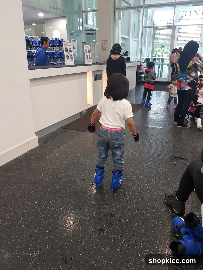 People at an indoor skating rink