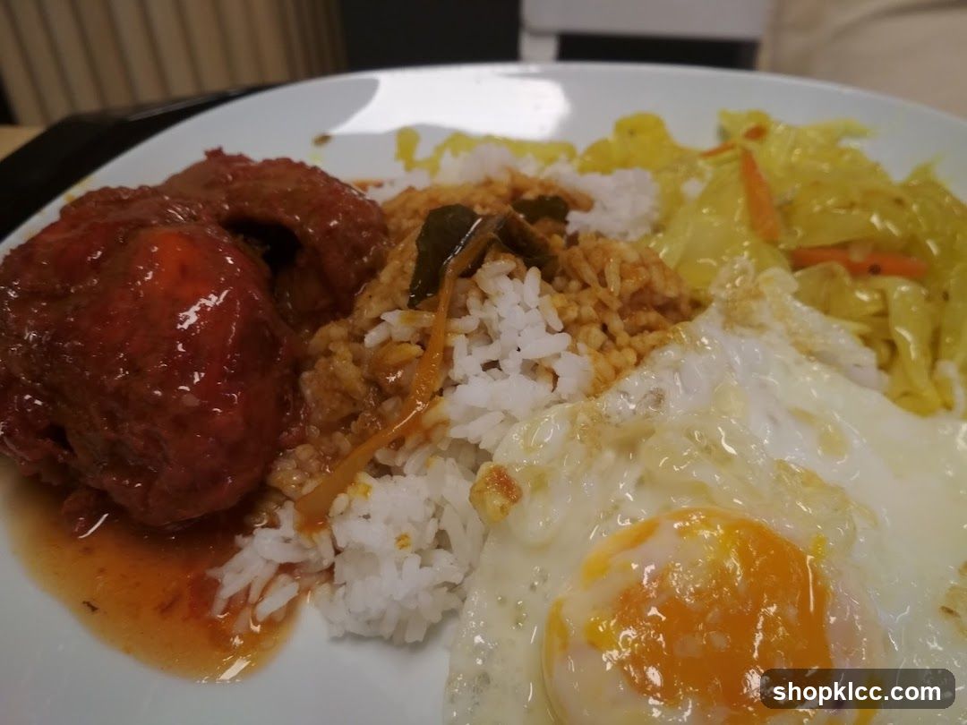 Plate of Fried Rice with Meatballs and Egg