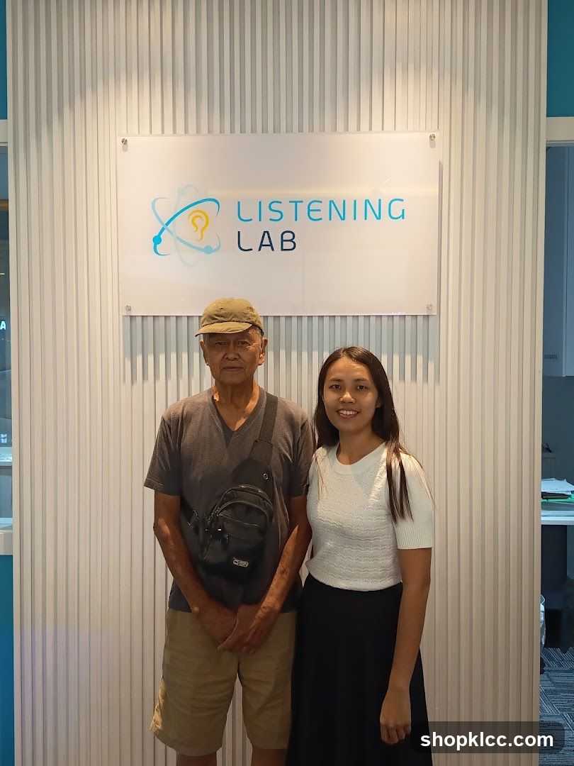 Listening Lab Signage with Two People Standing