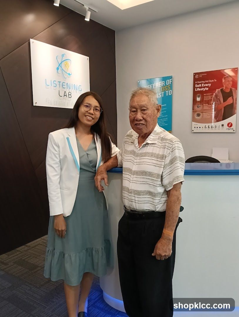 Listening Lab Interior with Staff and Senior Guest