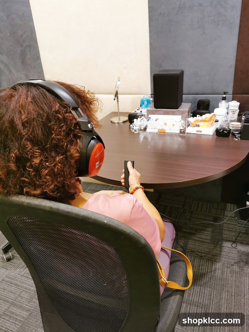 Person Listening to Audio in a Room