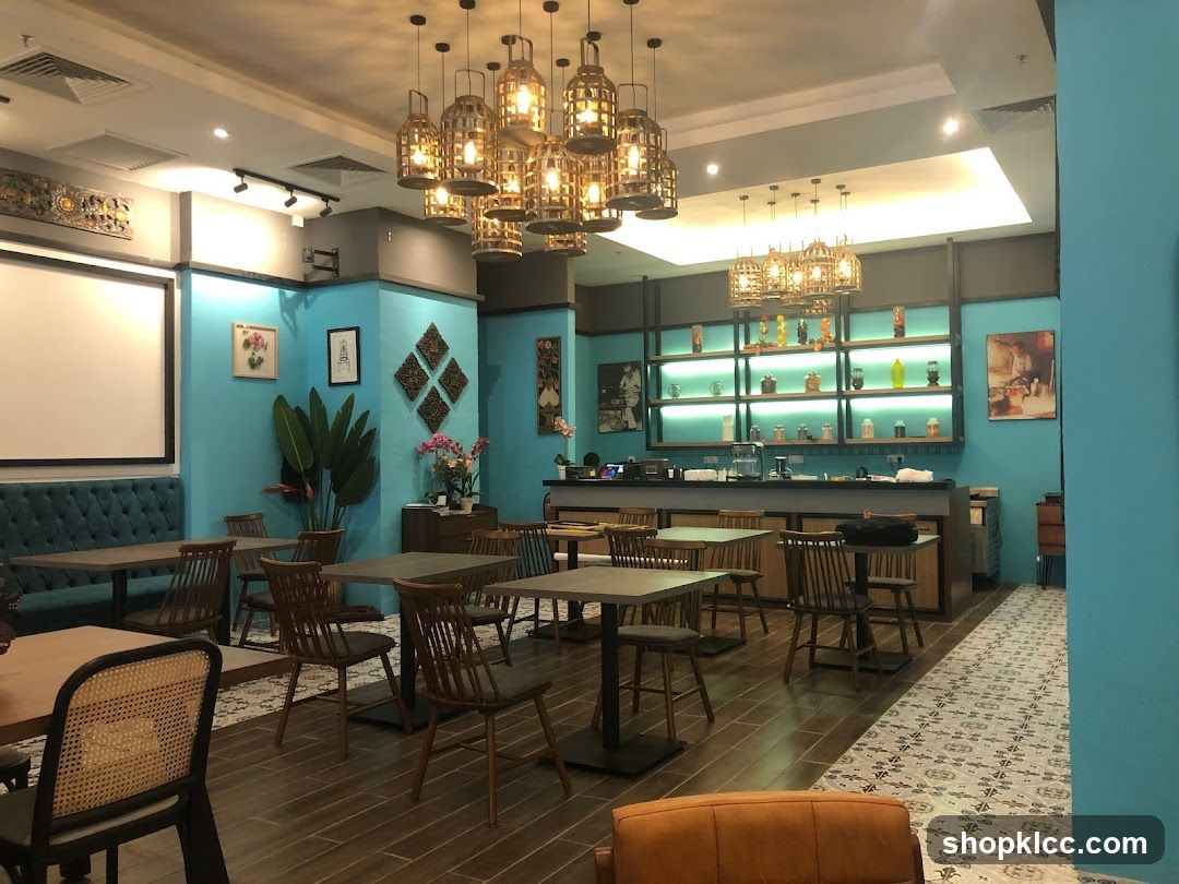Interior of a modern restaurant or cafe with blue walls and wooden furniture.