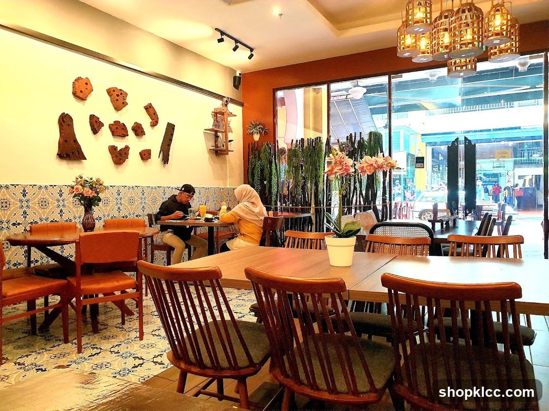 Interior of a cozy café with wooden furniture and decorative wall art