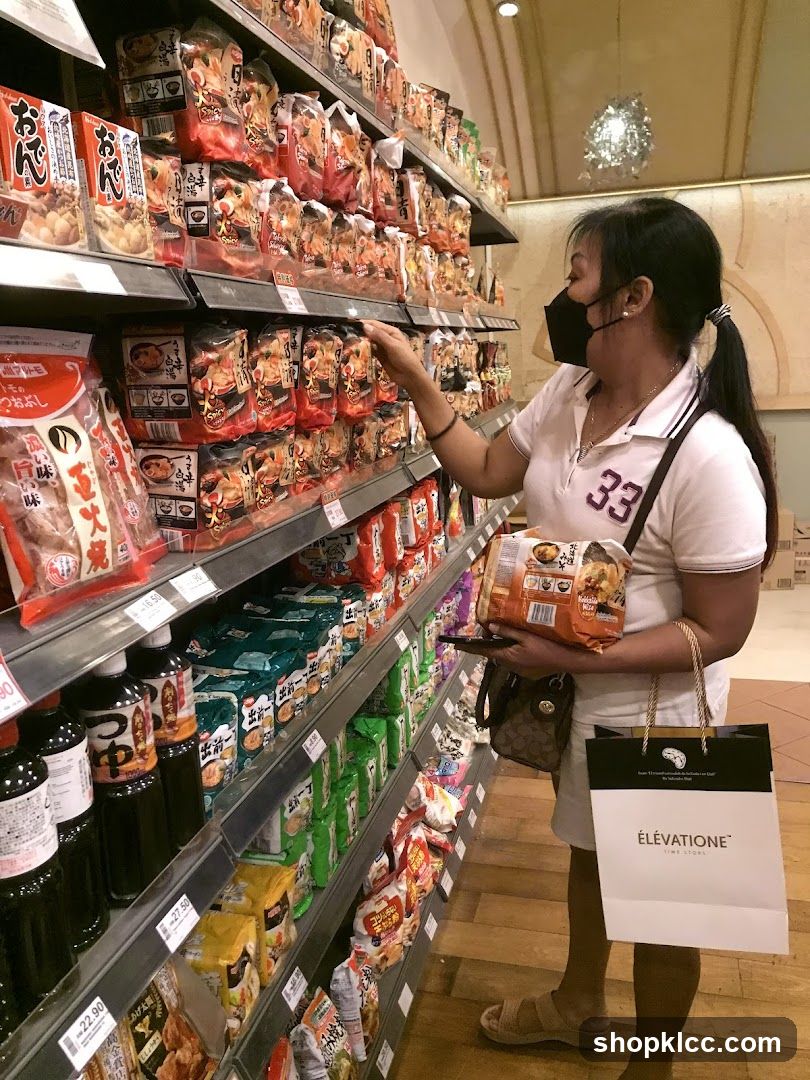 Woman shopping in a grocery store aisle