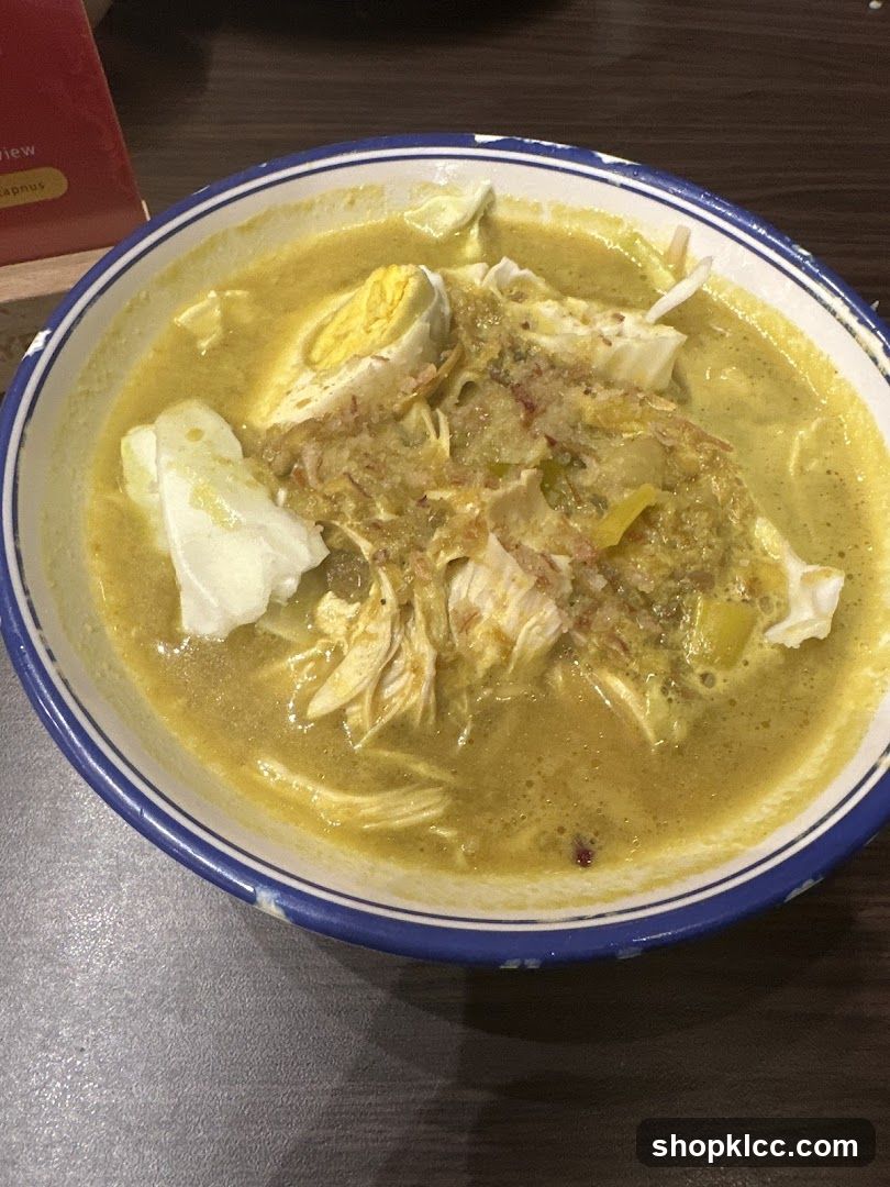 Bowl of Soup with Egg and Shredded Chicken