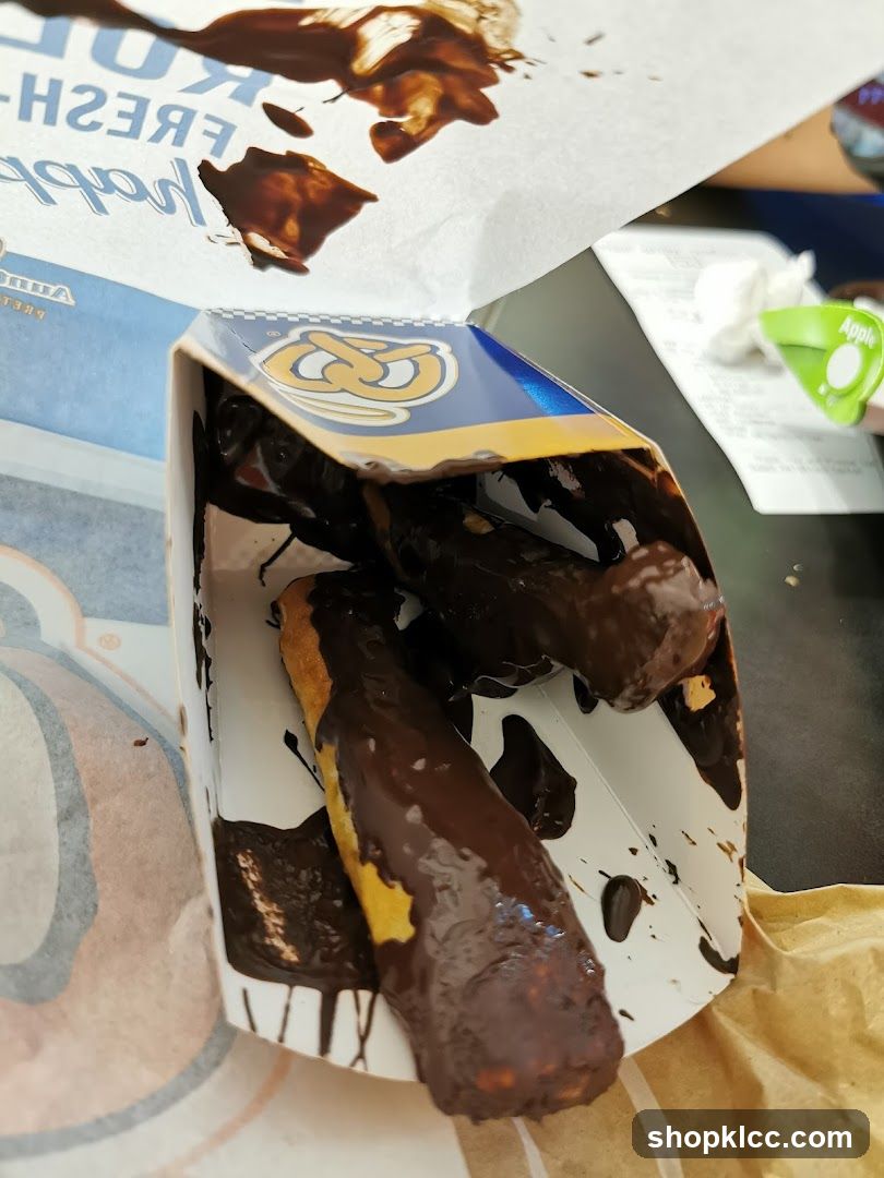 Chocolate-covered pretzel sticks in a box
