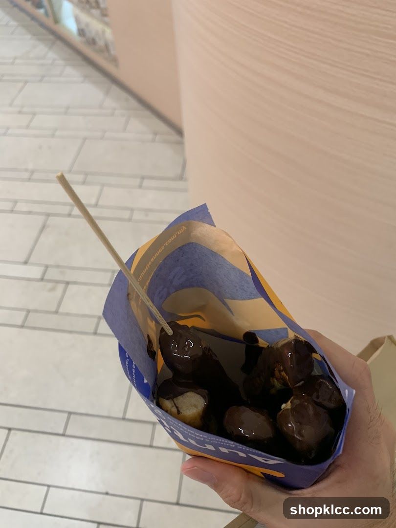 Chocolate-covered donut in a bag