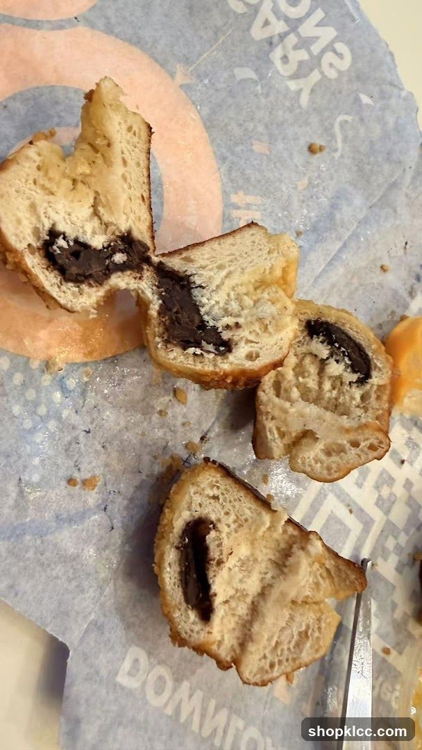 Chocolate-filled pastry on branded paper