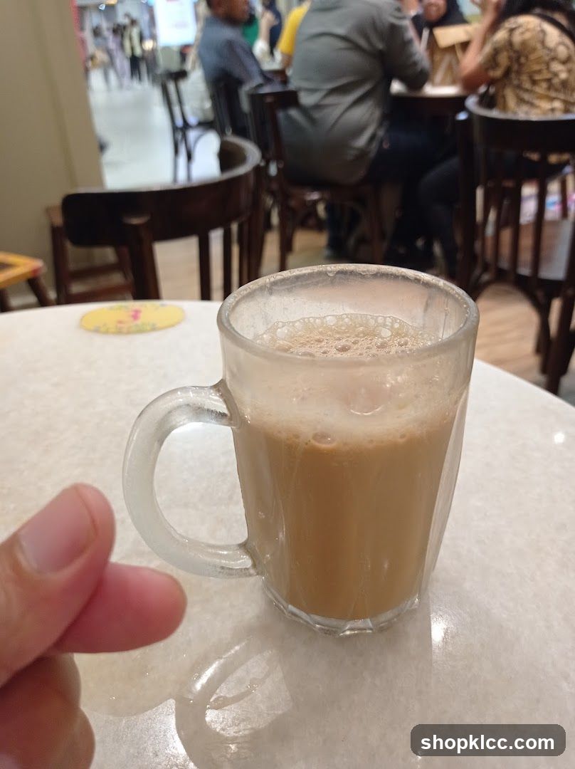 Coffee in a glass mug at a cafe