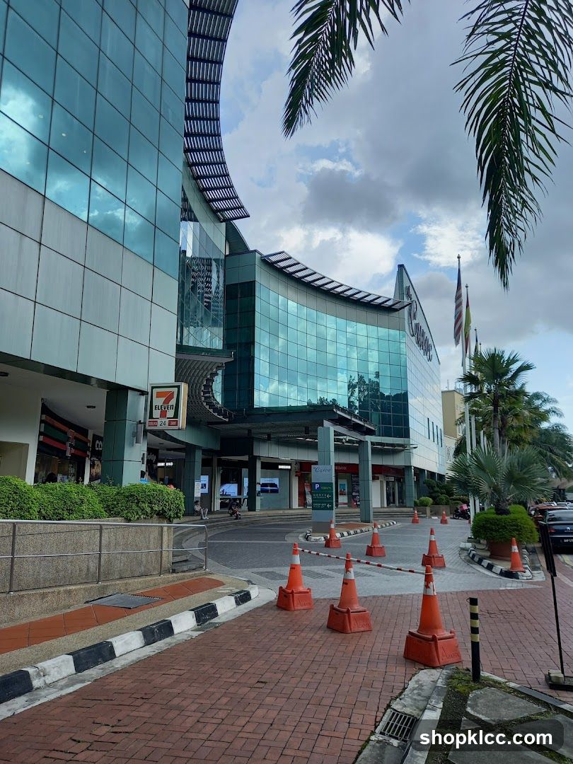 Shopping Center Exterior with Storefronts and Traffic Cones