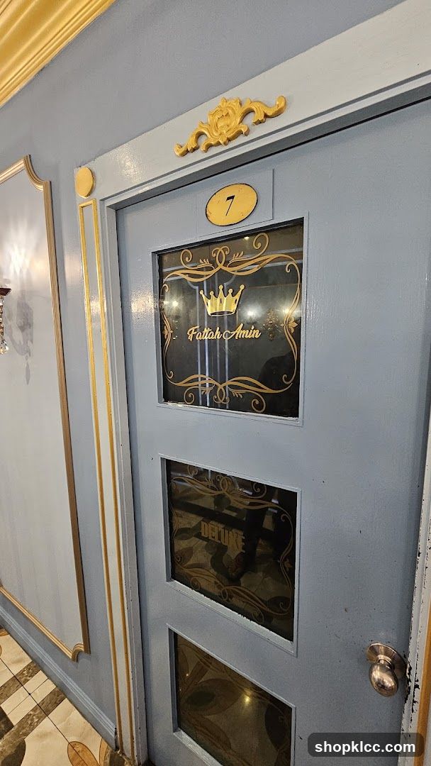Door with glass panels and gold lettering
