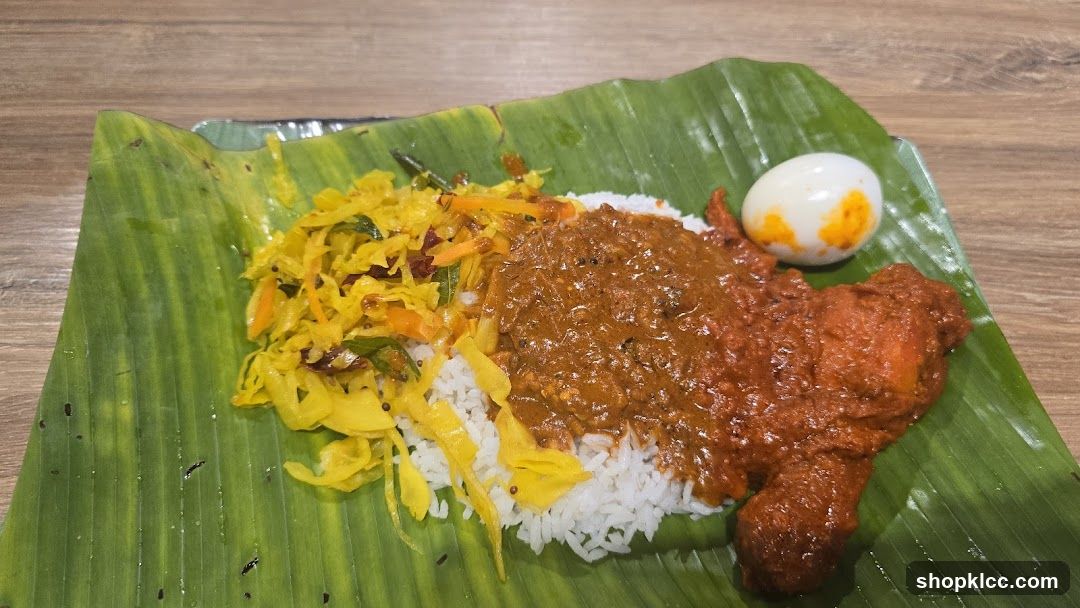 Rice plate with chicken curry and side dishes