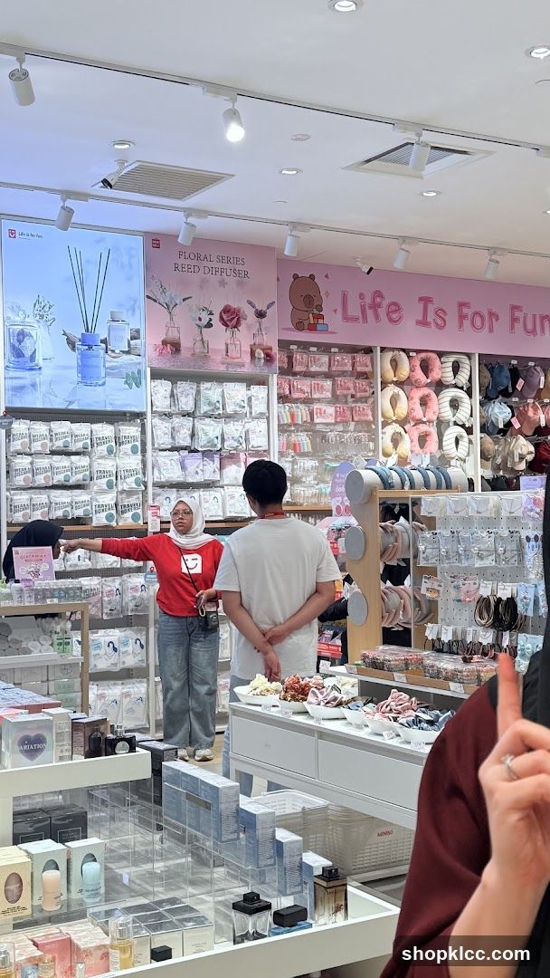 Interior of a retail store with customers browsing products