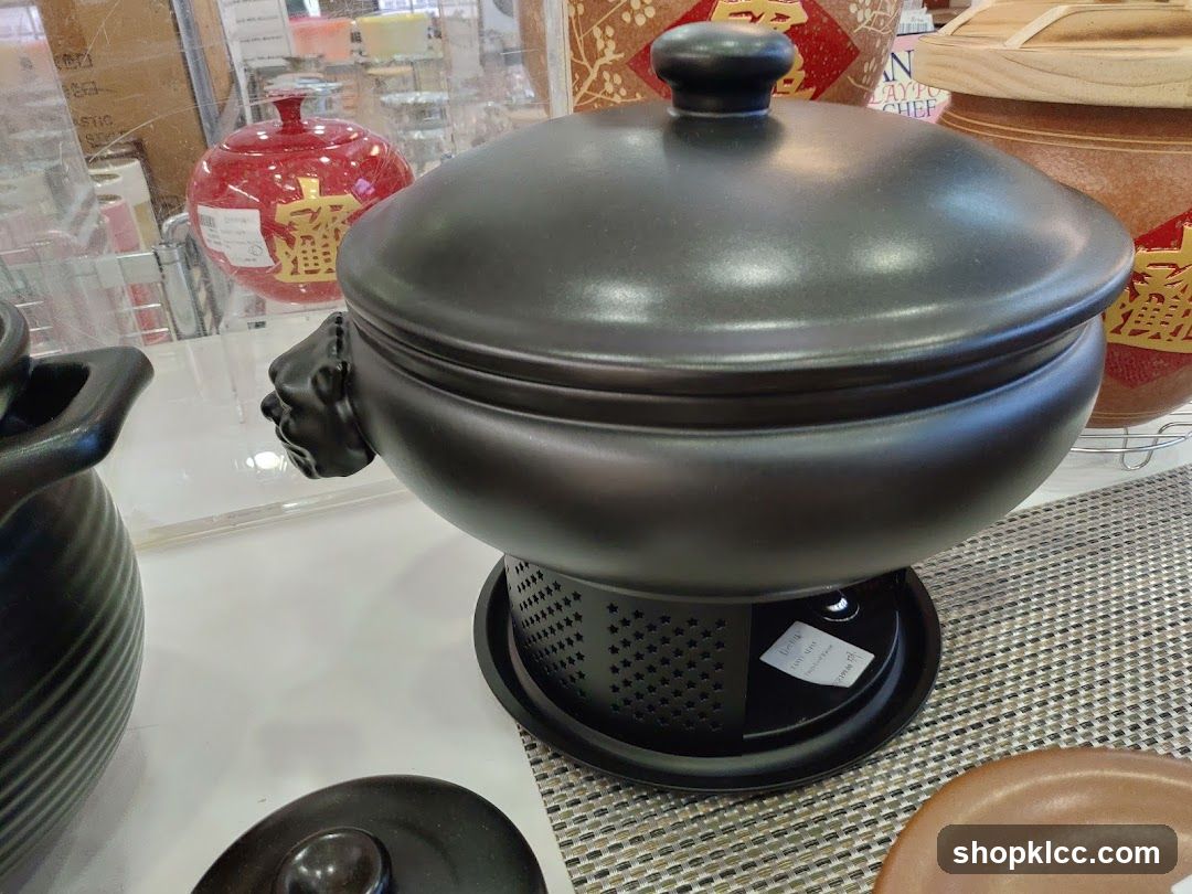 Black ceramic pot with lion handle