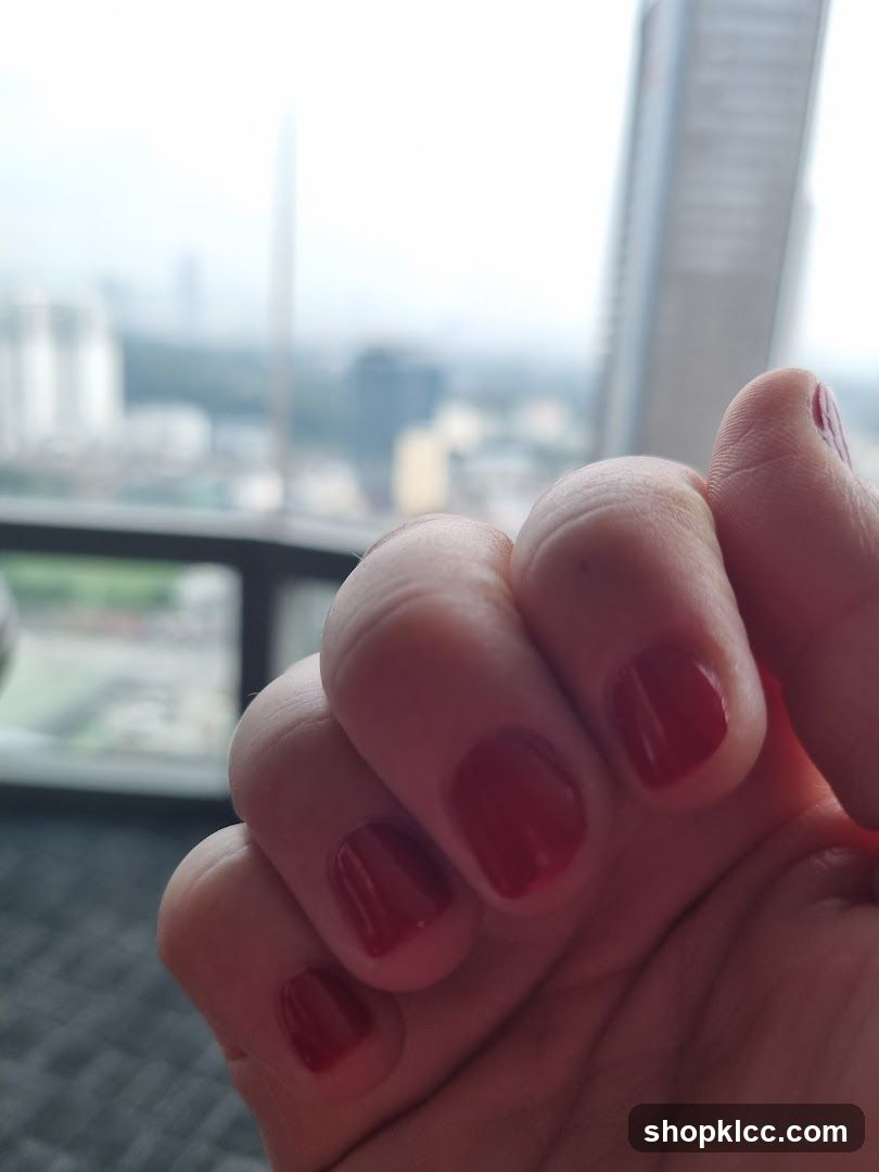 Hand with Red Nail Polish