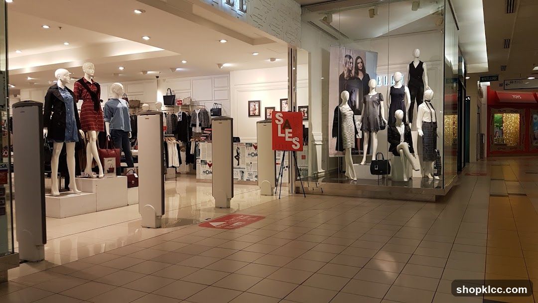 Fashion store with mannequins and sale sign