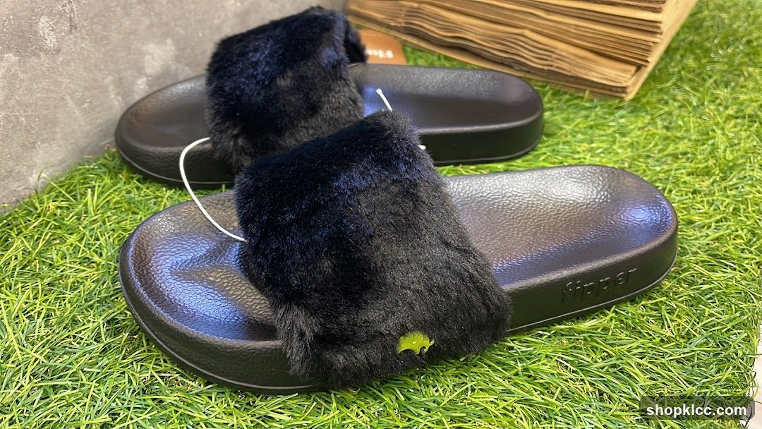 Black Furry Slides on Artificial Grass