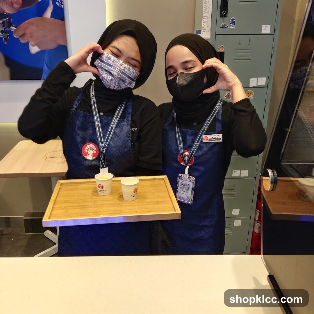 Two Baristas Offering Samples