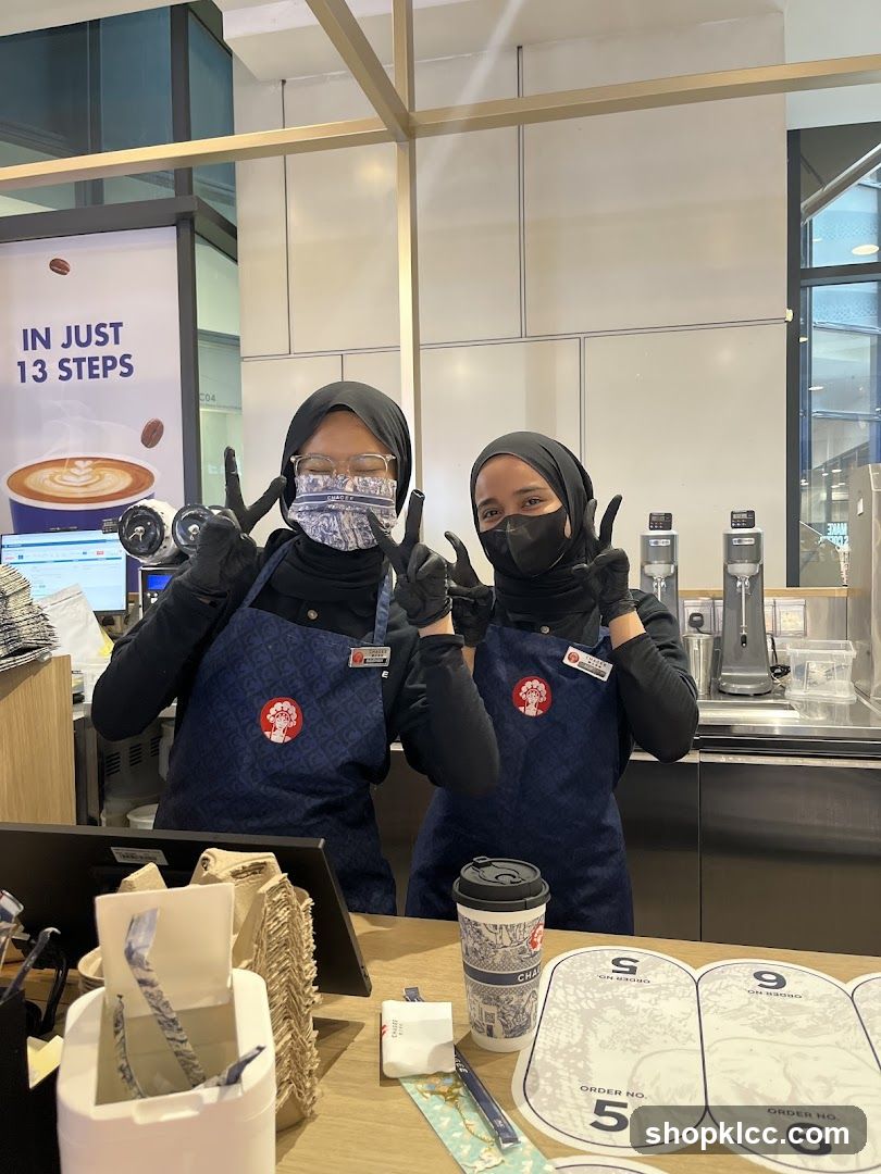 Baristas Posing at Counter