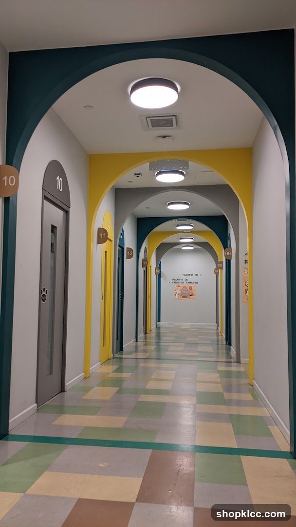 Hallway with Arches and Numbered Doors