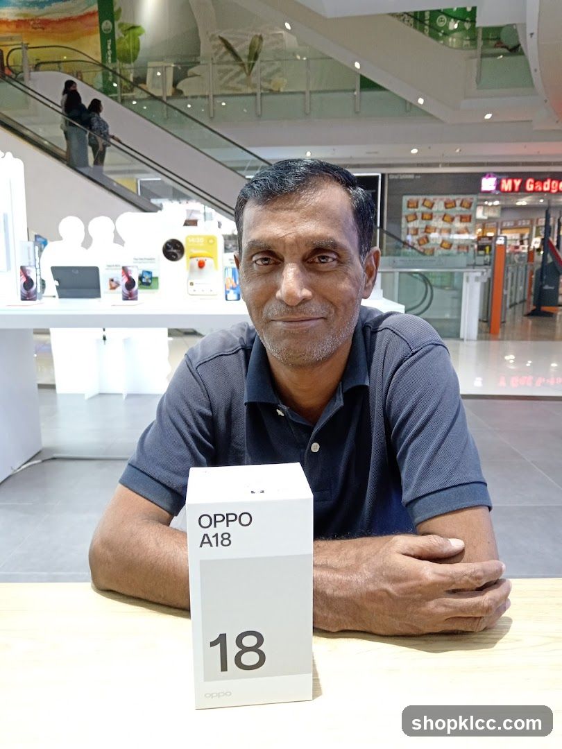 Man with OPPO A18 box