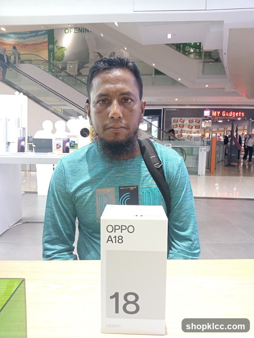 Man Posing with OPPO A18 Box