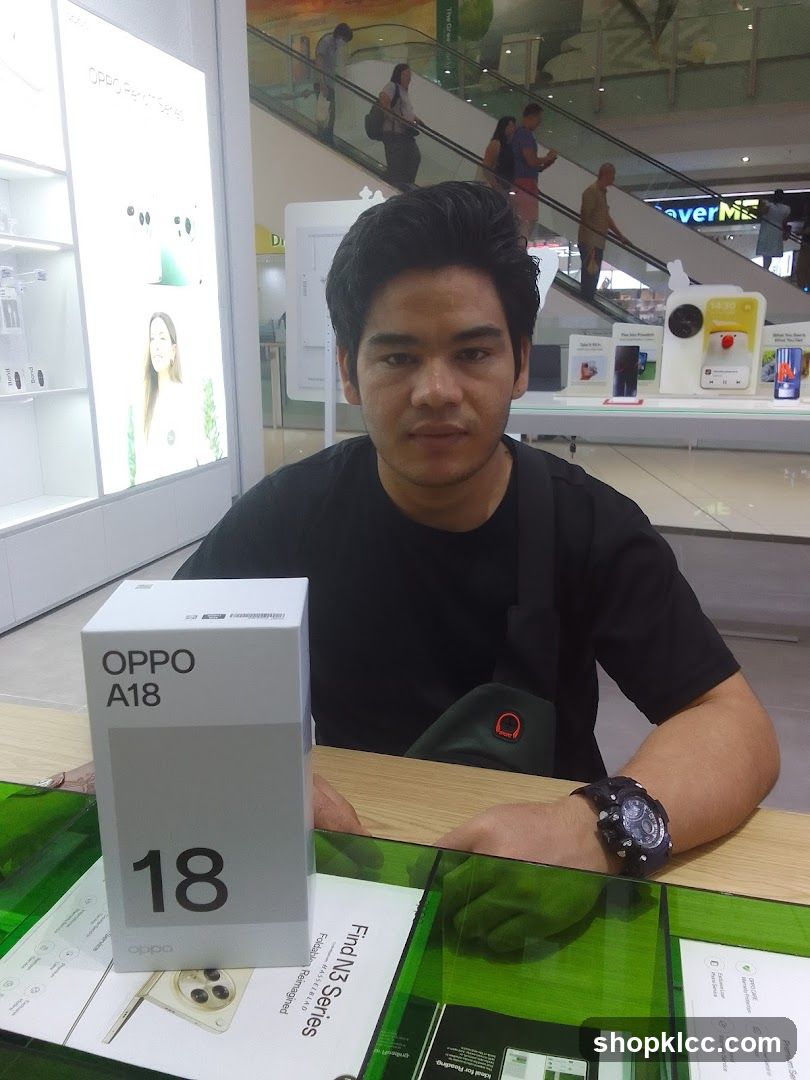 Man with OPPO A18 box