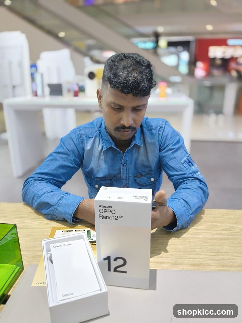 Man with OPPO Reno 12 5G box