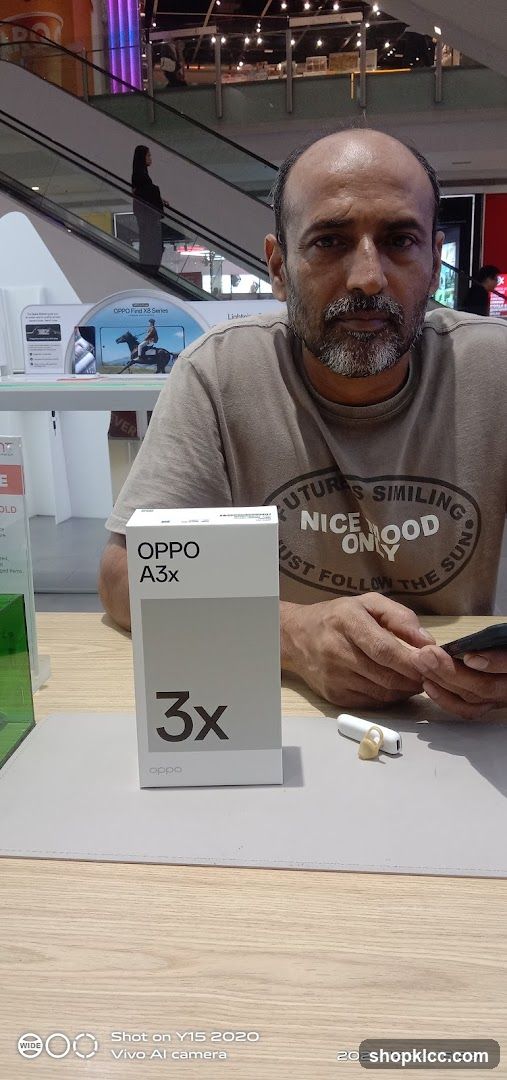 Man with OPPO A3x box