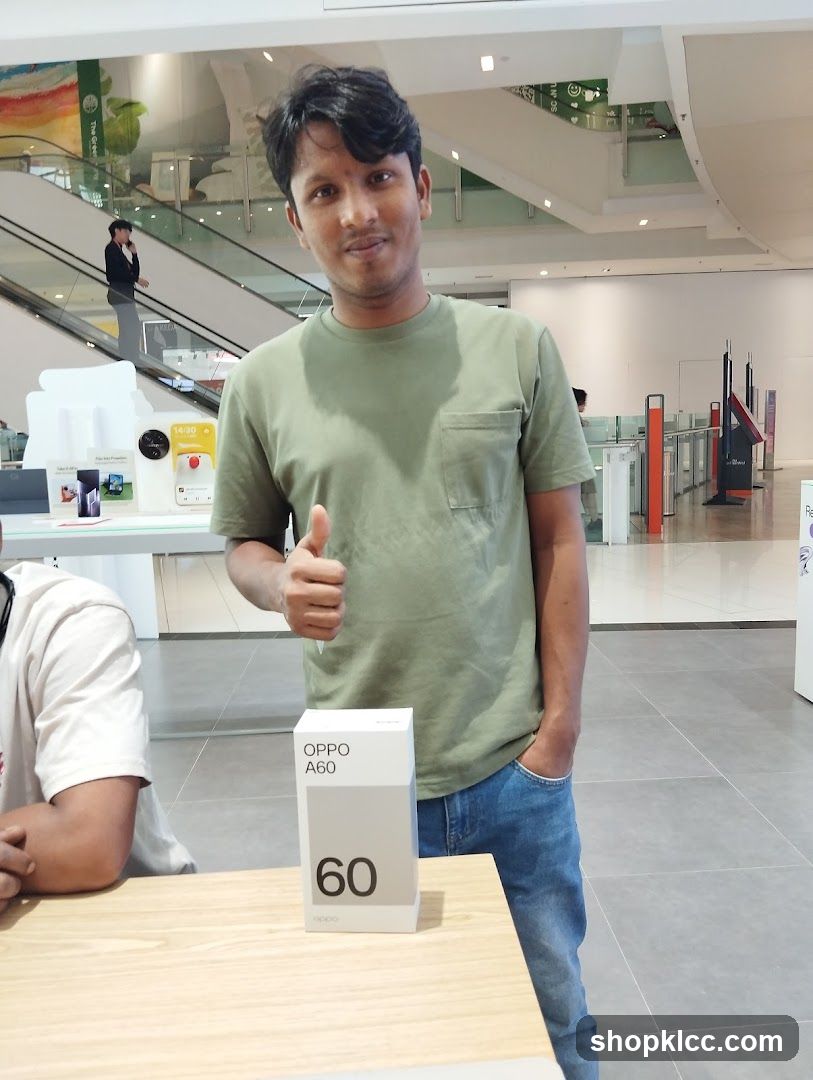 Man with OPPO A60 box