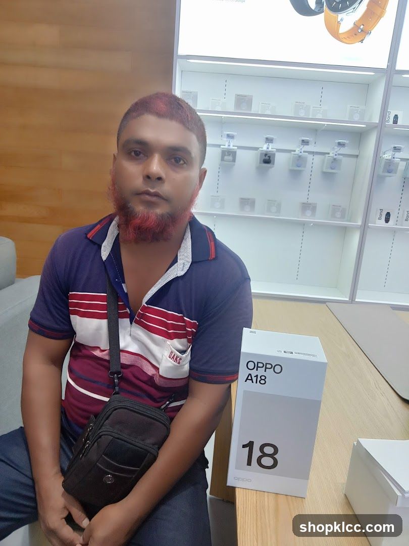 Man with OPPO A18 box