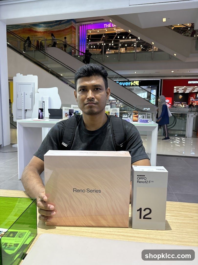 Man with OPPO Reno Series Box