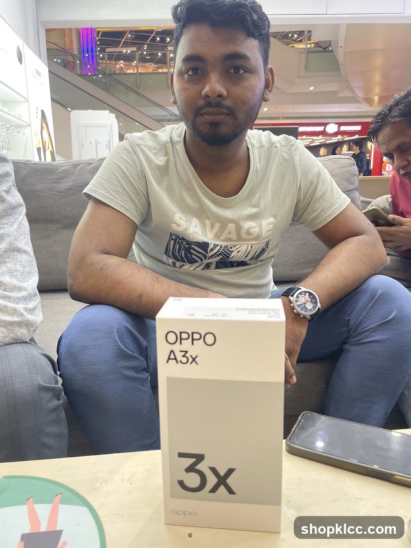 Man with OPPO A3x box