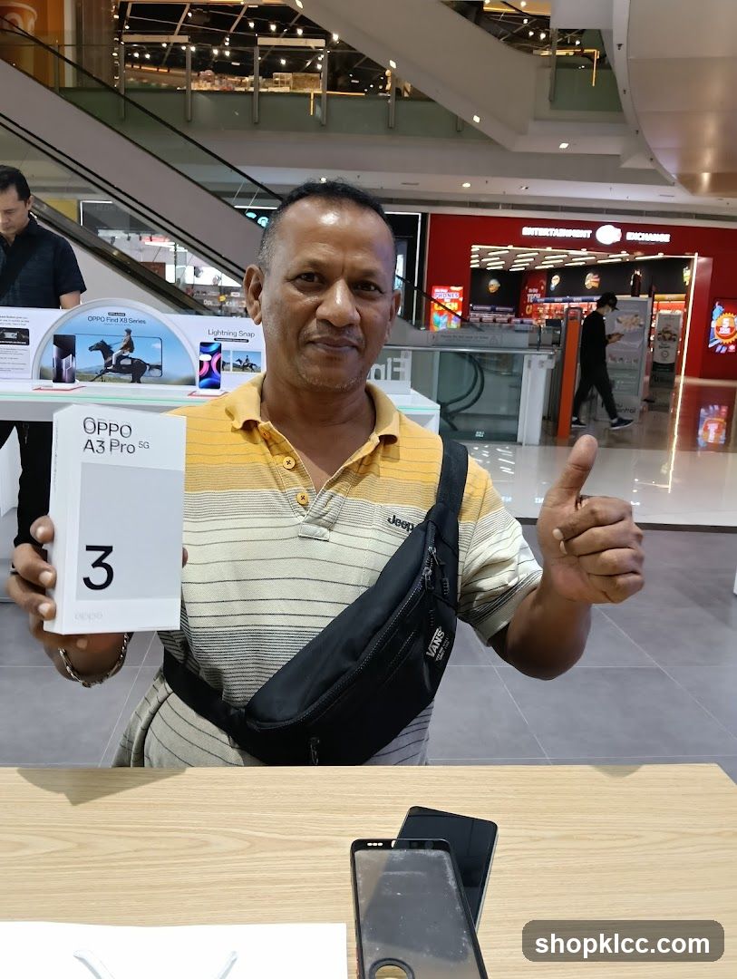 Man holding an Oppo phone box