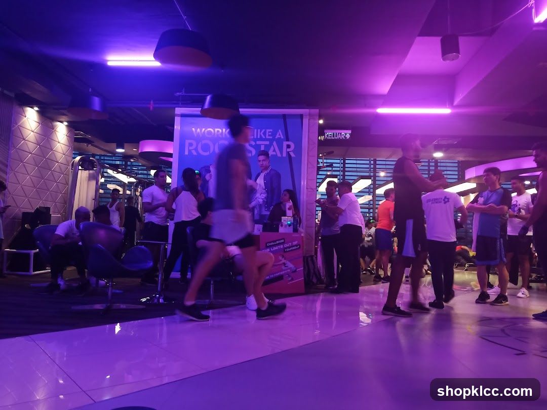 Gym interior with people and motivational poster