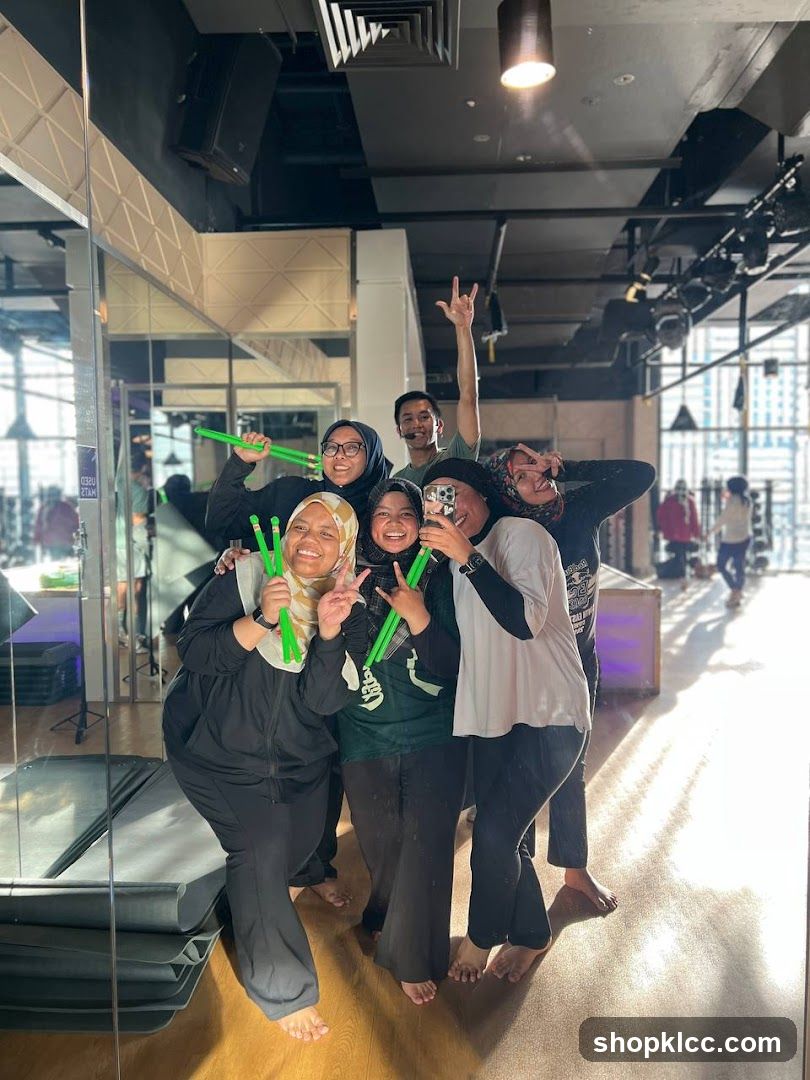 Group posing for a selfie in a studio