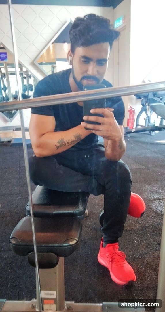 Man taking a selfie in a gym