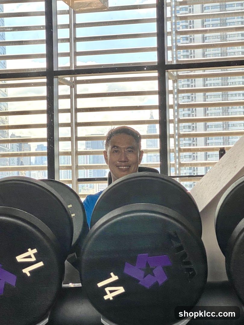 Man in Gym with Dumbbells