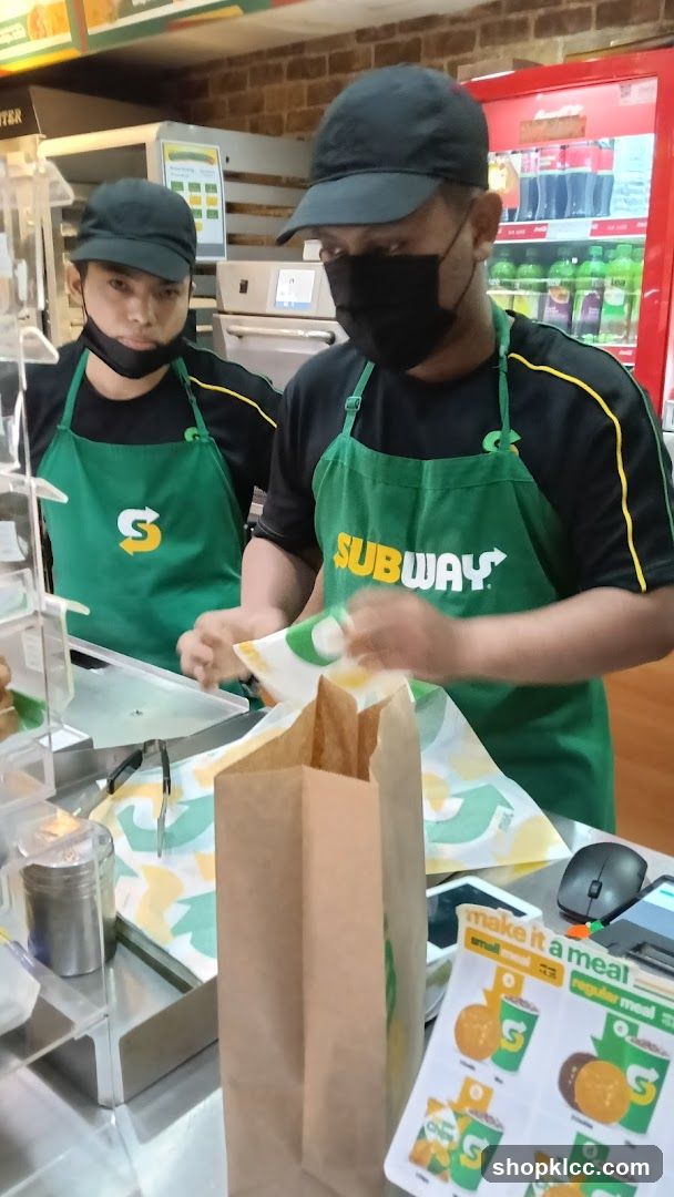 Subway Employees Preparing Order