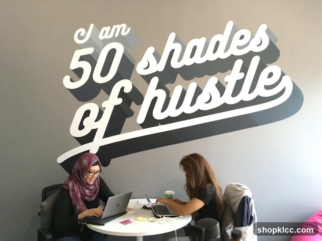 Two women working on laptops