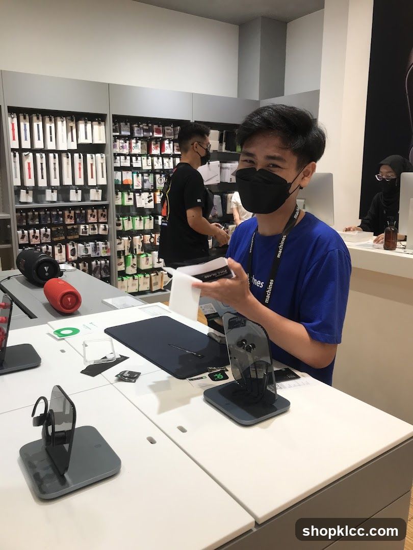 Store employee assisting customer